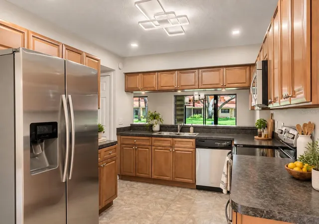 Photo 1 of Townhouse for sale at 8235 Ambrose Cvs Way, Orlando, FL 32819 | MLS# O6446808 | Listing updated on 2026-10-23