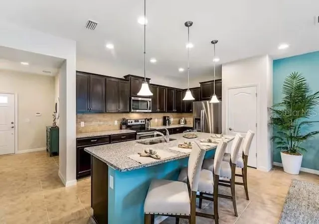 Photo 4 of Townhouse for sale at 8887 Geneve Ct, Kissimmee, FL 34747 | MLS# O6446813 | Listing updated on 2026-10-08