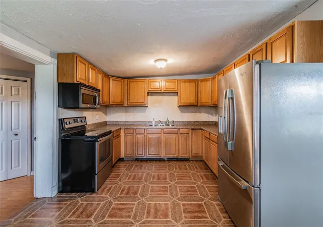 Photo 3 of Single family home for sale at 113 Stoody Ave, Auburndale, FL 33823 | MLS# TB8554507 | Listing updated on 2026-10-06