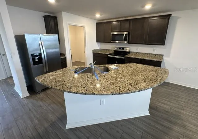 Photo 4 of Townhouse for sale at 1695 Wynford Cir, Tavares, FL 32778 | MLS# O6446991 | Listing updated on 2026-10-03