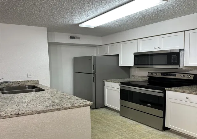 Listing Photo 3 - Condo for sale in building located at 2214 Metropolitan Wy, Orlando, FL 32839 - Unit #1022