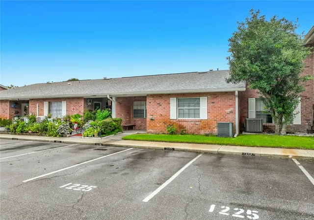 Photo 1 of Townhouse for sale at 1225 Carriage Ln #1, Orlando, FL 32807 | MLS# O6447144 | Listing updated on 2026-10-08