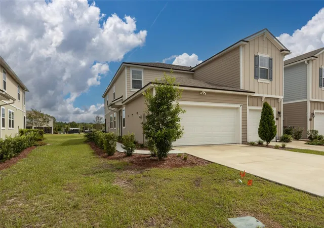 Photo 1 of Townhouse for sale at 336 Redbud Rd, Palm Coast, FL 32137 | MLS# FC321910 | Listing updated on 2026-10-07