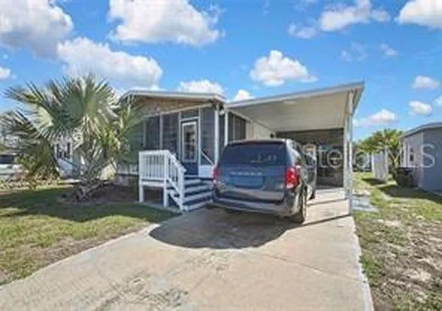 Photo 1 of Manufactured home for sale at 2400 Lemur Dr, Holiday, FL 34690 | MLS# TB8554875 | Listing updated on 2026-10-06