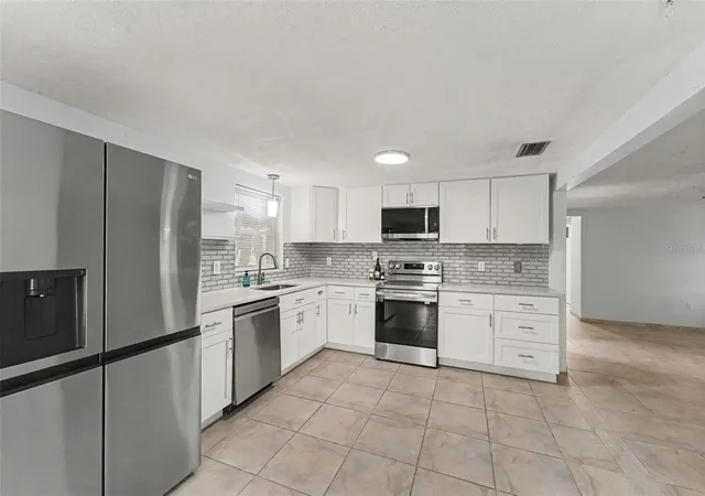 Photo 4 of Single family home for sale at 7922 Lilac Dr, Port Richey, FL 34668 | MLS# TB8554994 | Listing updated on 2026-10-11