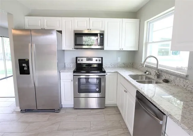 Photo 4 of Single family home for sale at 1420 Thomas St, Titusville, FL 32780 | MLS# O6447451 | Listing updated on 2026-10-06