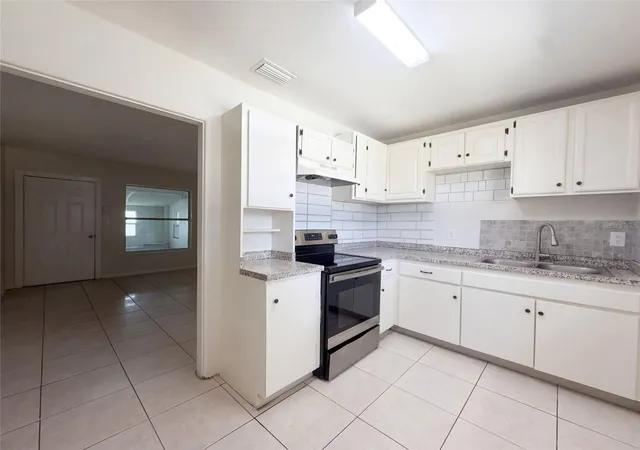 Photo 2 of Single family home for sale at 7916 Endive Ave, Tampa, FL 33619 | MLS# O6447458 | Listing updated on 2026-10-06