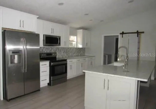 Photo 3 of Single family home for sale at 1009 Fort Smith Blvd, Deltona, FL 32725 | MLS# O6447560 | Listing updated on 2026-10-06