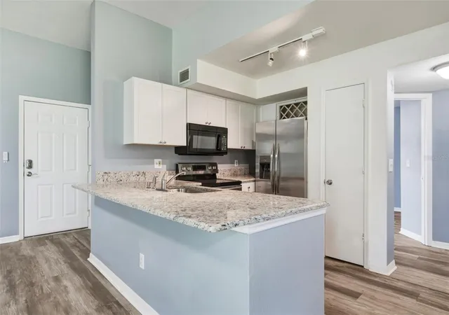 Photo 4 of Condo for sale at 7250 Westpointe Blvd #1034, Orlando, FL 32835 | MLS# O6447576 | Listing updated on 2026-10-07