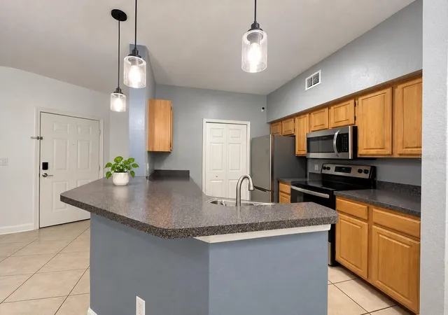 Photo 3 of Condo for sale at 5961 Westgate Dr #2023, Orlando, FL 32835 | MLS# O6447915 | Listing updated on 2026-10-07