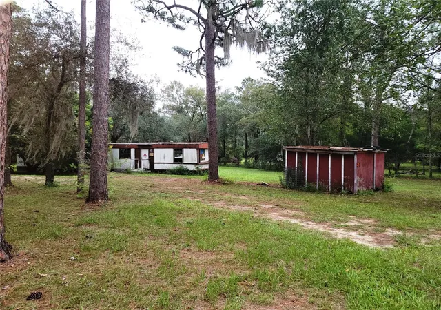 Photo 2 of Manufactured home for sale at 12231 NE 64 Place, Williston, FL 32696 | MLS# OM733597 | Listing updated on 2026-10-07