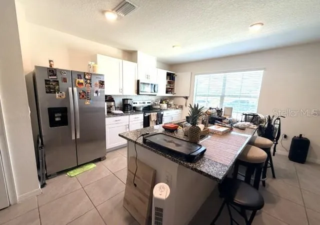 Photo 1 of Townhouse for sale at 1629 Bitteroot St, Kissimmee, FL 34744 | MLS# O6447999 | Listing updated on 2026-10-08