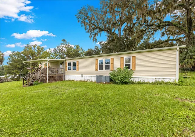 Photo 2 of Manufactured home for sale at 5135 Se 125th Street, Belleview, FL 34420 | MLS# OM733629 | Listing updated on 2026-10-09