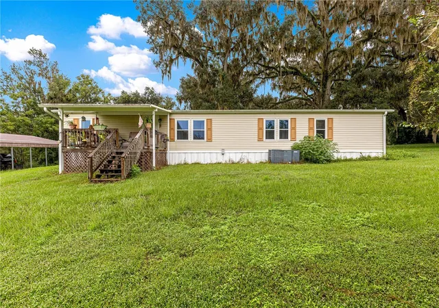 Photo 3 of Manufactured home for sale at 5135 SE 125th Street, Belleview, FL 34420 | MLS# OM733629 | Listing updated on 2026-10-09