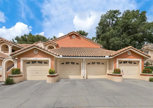 Photo 1 of Townhouse for sale at 7711 Sugar Bnd Dr, Orlando, FL 32819 | MLS# O6448075 | Listing updated on 2026-10-24