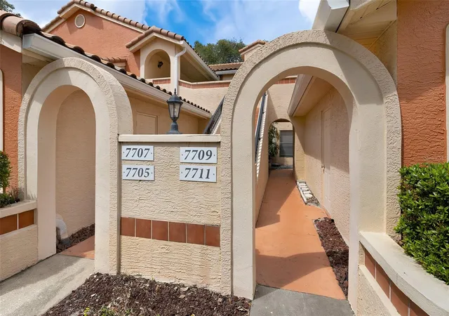 Photo 1 of Townhouse for sale at 7711 Sugar Bnd Dr, Orlando, FL 32819 | MLS# O6448075 | Listing updated on 2026-10-24