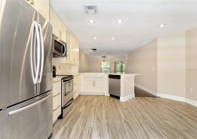 Photo 4 of Townhouse for sale at 7711 Sugar Bnd Dr, Orlando, FL 32819 | MLS# O6448075 | Listing updated on 2026-10-24
