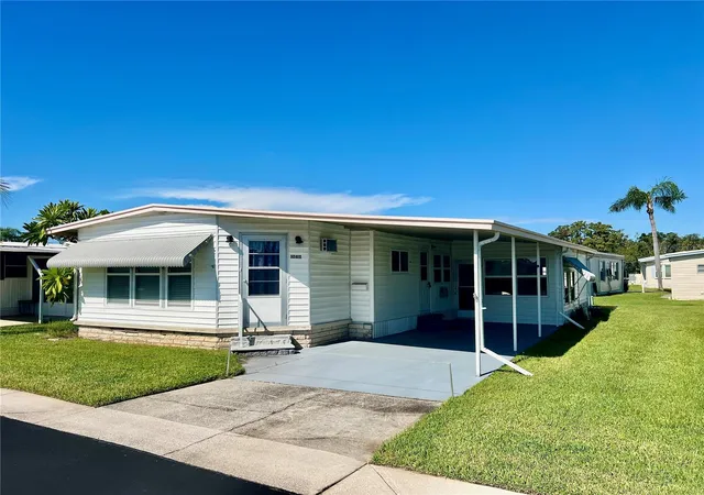 Photo 2 of Manufactured home for sale at 10811 Freedom Dr, Port Richey, FL 34668 | MLS# W7890180 | Listing updated on 2026-10-08