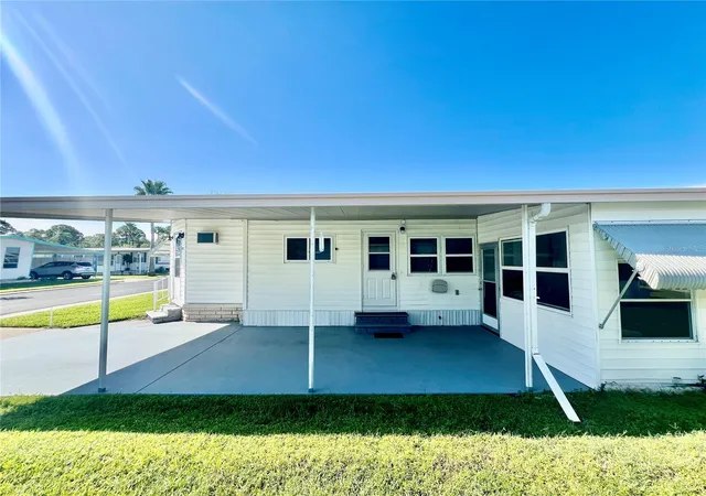 Photo 3 of Manufactured home for sale at 10811 Freedom Dr, Port Richey, FL 34668 | MLS# W7890180 | Listing updated on 2026-10-08