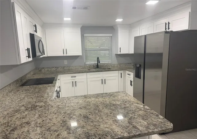 Photo 2 of Single family home for sale at 8501 N Packwood Ave, Tampa, FL 33604 | MLS# TB8556020 | Listing updated on 2026-10-09