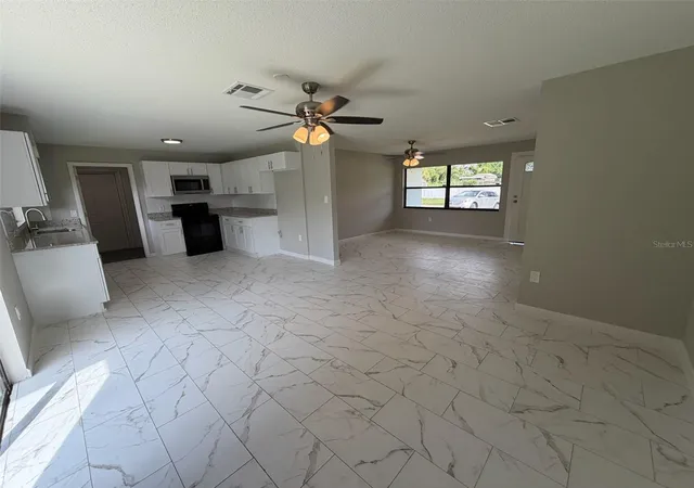 Photo 3 of Single family home for sale at 7008 Harwick Dr, Orlando, FL 32818 | MLS# O6448369 | Listing updated on 2026-10-09