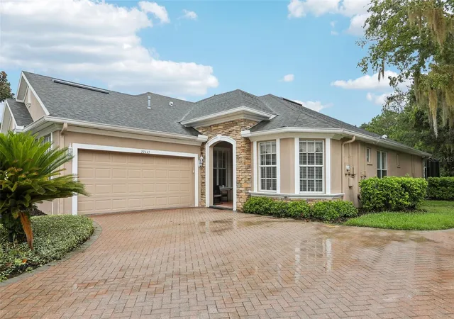 Photo 1 of Single family home for sale at 27443 Mistflower Dr, Wesley Chapel, FL 33544 | MLS# TB8556365 | Listing updated on 2026-10-11