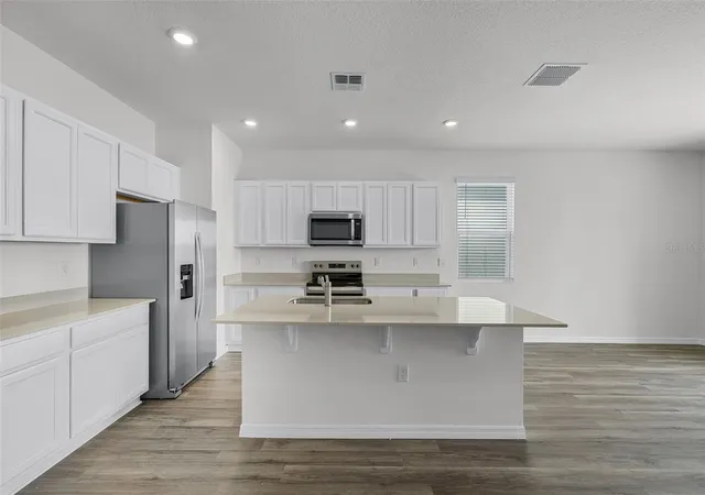 Photo 4 of Townhouse for sale at 1821 Wooden St, Davenport, FL 33837 | MLS# O6448503 | Listing updated on 2026-10-09
