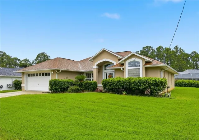 Single family home for sale at 65 Woodbury Dr, PALM COAST, FL 32164 | MLS# FC322022