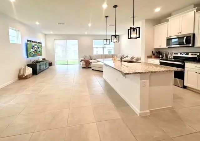 Photo 3 of Townhouse for sale at 1123 Boardwalk Pl, Kissimmee, FL 34747 | MLS# O6448594 | Listing updated on 2026-10-20