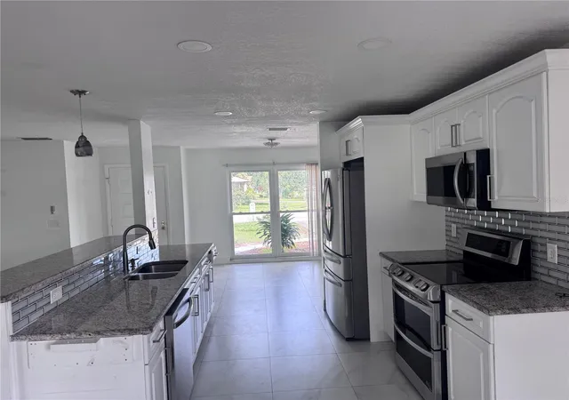 Photo 3 of Single family home for sale at 5208 Carrollwood Meadows Dr, Tampa, FL 33625 | MLS# TB8556623 | Listing updated on 2026-10-10