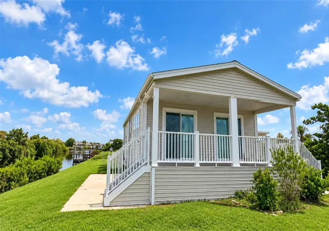Photo 4 of Manufactured home for sale at 734 Blackburn Blvd, North Port, FL 34287 | MLS# C7531815 | Listing updated on 2026-10-22