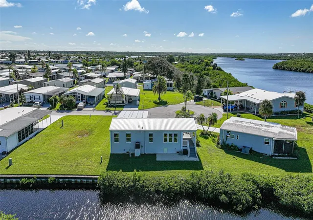 Photo 3 of Manufactured home for sale at 734 Blackburn Blvd, North Port, FL 34287 | MLS# C7531815 | Listing updated on 2026-10-22