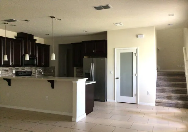 Photo 4 of Townhouse for sale at 2564 Fassona Dr, Kissimmee, FL 34741 | MLS# O6448764 | Listing updated on 2026-10-12