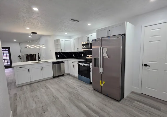 Photo 3 of Single family home for sale at 5044 Roanoke Dr, Holiday, FL 34690 | MLS# TB8557008 | Listing updated on 2026-10-11