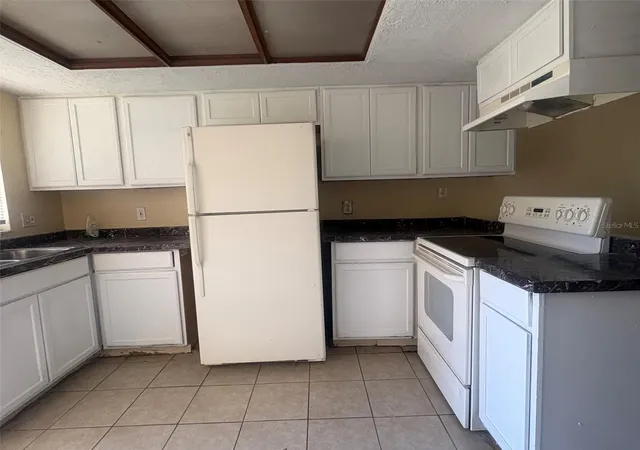 Photo 1 of Townhouse for sale at 12723 Lockey Ln, Tampa, FL 33612 | MLS# TB8557033 | Listing updated on 2026-10-15