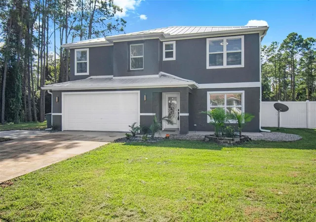 Photo 2 of Single family home for sale at 61 Reidsville Dr, Palm Coast, FL 32164 | MLS# FC322068 | Listing updated on 2026-10-24