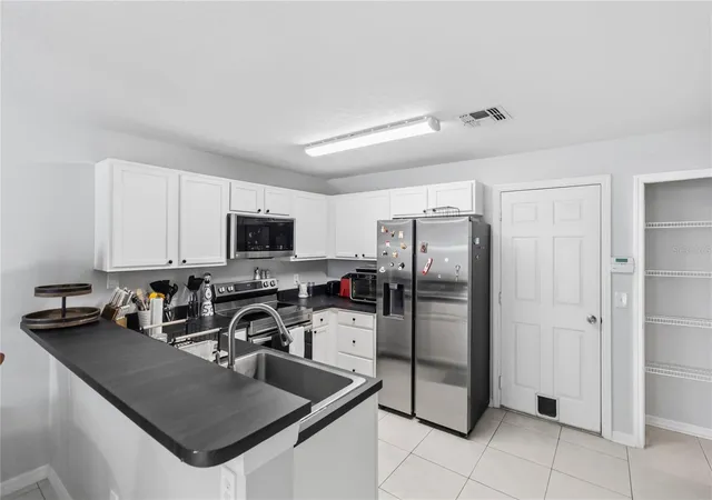 Photo 4 of Townhouse for sale at 13015 Lexington Summit St, Orlando, FL 32828 | MLS# O6449266 | Listing updated on 2026-10-15