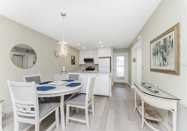 Listing Photo 1 - Condo for sale in building located at 6600 Gasparilla Pines Blvd, ENGLEWOOD, FL 34224 - Unit #14-103