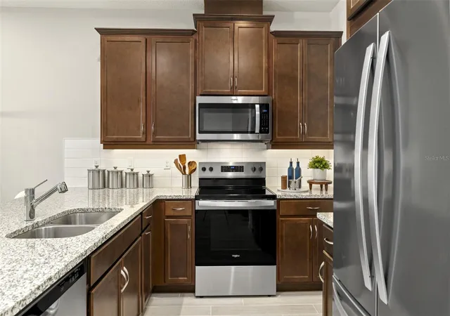 Photo 4 of Townhouse for sale at 10143 Milestone Cir, Orlando, FL 32832 | MLS# O6449288 | Listing updated on 2026-10-25