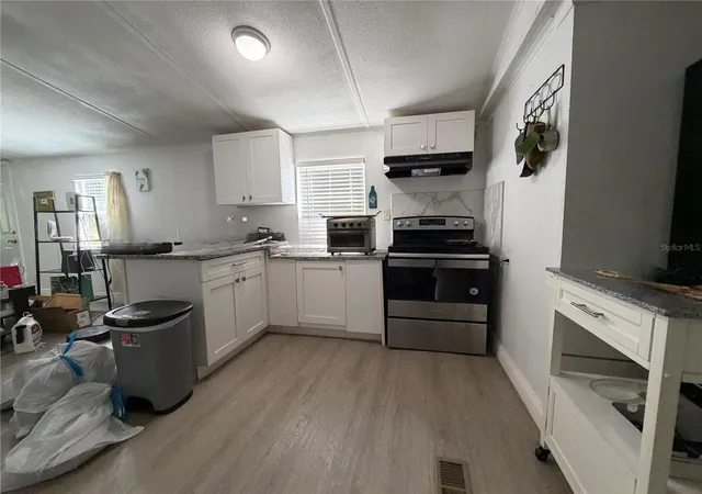 Photo 3 of Manufactured home for sale at 17327 Trojantown Dr, Spring Hill, FL 34610 | MLS# TB8557467 | Listing updated on 2026-10-13