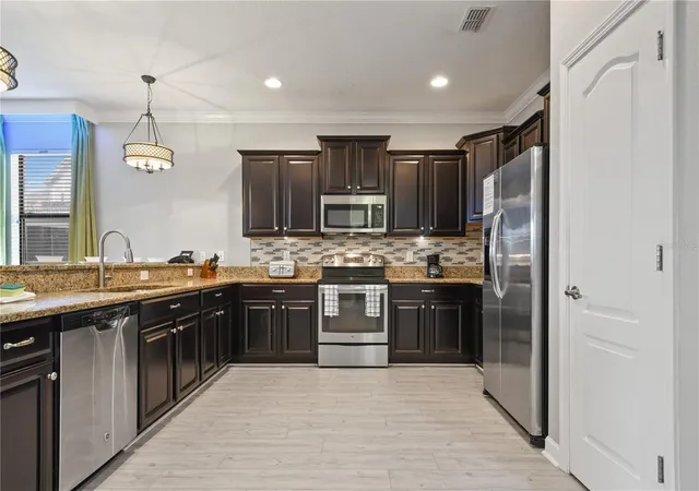 Photo 3 of Single family home for sale at 1415 Moon Valley Dr, Davenport, FL 33896 | MLS# O6450039 | Listing updated on 2026-10-15
