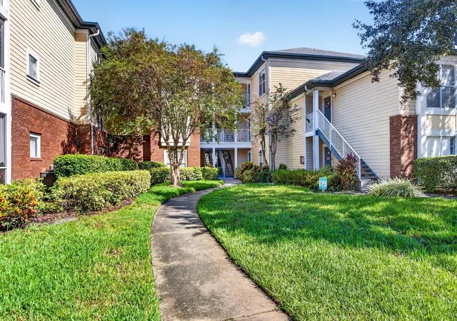Listing Photo 1 - Condo for sale in building located at 4211 Chatham Oak Ct, Tampa, FL 33624 - Unit #111