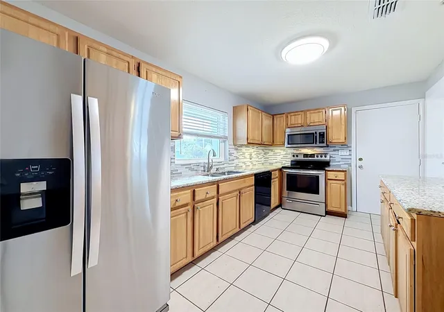 Photo 2 of Single family home for sale at 8424 Pocasset Pl, Orlando, FL 32827 | MLS# O6450797 | Listing updated on 2026-10-24