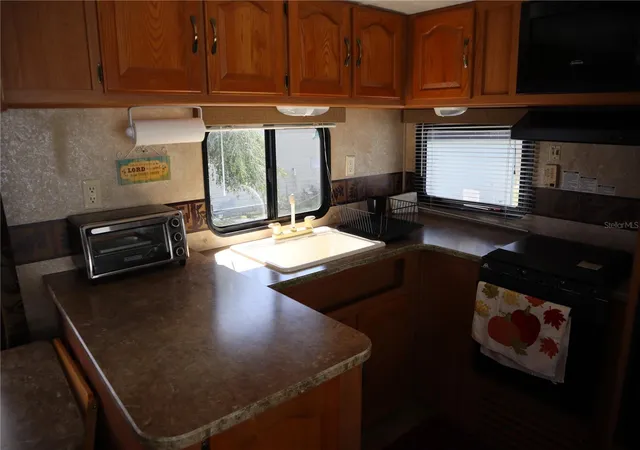 Photo 4 of Manufactured home for sale at 9431 Cougar Dr, Weeki Wachee, FL 34613 | MLS# W7890423 | Listing updated on 2026-10-19