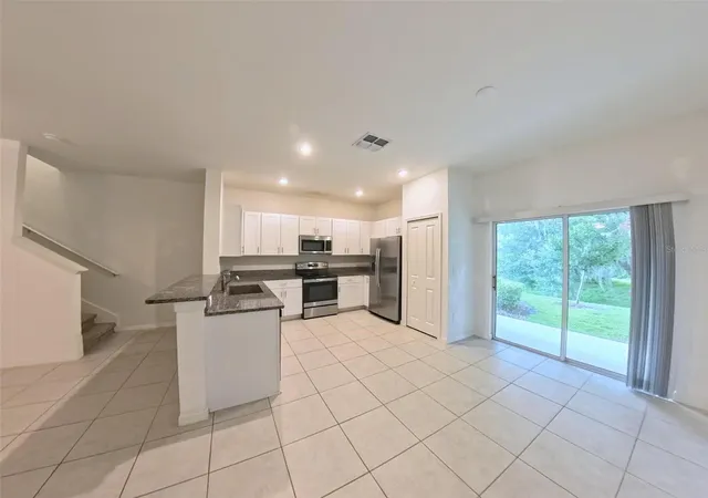 Photo 3 of Townhouse for sale at 14-25-20-0130-00000-2140 Trumpet Honeysuckle Way, San Antonio, FL 33576 | MLS# O6451218 | Listing updated on 2026-10-21