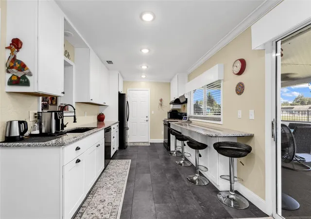 Photo 4 of Single family home for sale at 574 Azalea Ave NW, Port Charlotte, FL 33952 | MLS# C7532262 | Listing updated on 2026-10-28