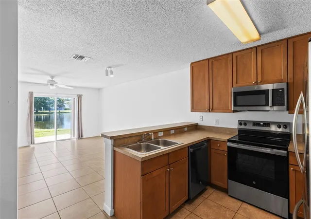 Photo 4 of Townhouse for sale at 12916 Lexington Summit St, Orlando, FL 32828 | MLS# O6451332 | Listing updated on 2026-10-24