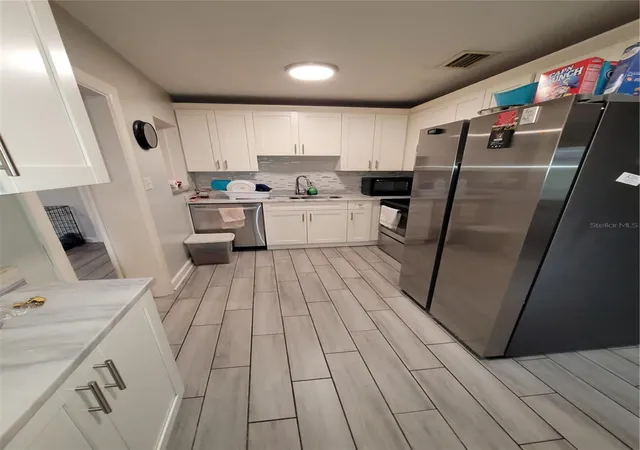 Photo 4 of Single family home for sale at 4417 Booker T Dr, Tampa, FL 33610 | MLS# TB8560092 | Listing updated on 2026-10-22