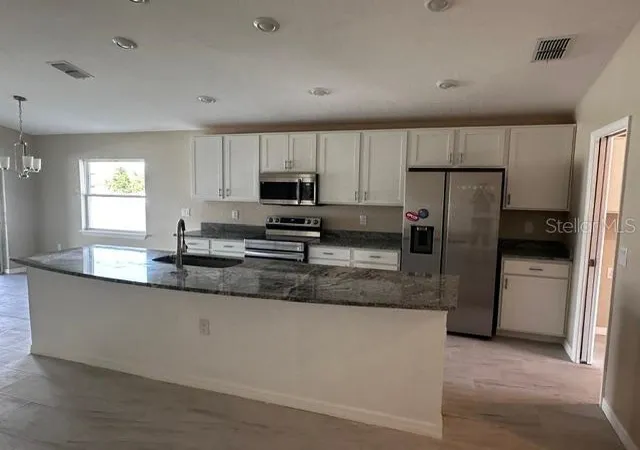 Photo 3 of Single family home for sale at 1073 Silas St, Haines City, FL 33844 | MLS# TB8560491 | Listing updated on 2026-10-23