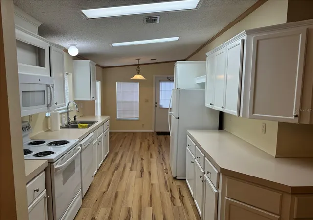 Photo 3 of Manufactured home for sale at 8930 Ehren Cutoff, Land O Lakes, FL 34639 | MLS# TB8560642 | Listing updated on 2026-10-23